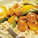 Ginger orange chicken with pea pods and red and green peppers