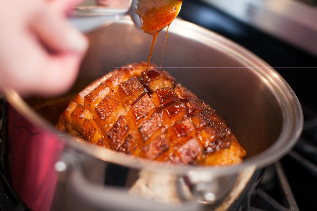 Maple-Balsamic-Ginger-glazed-Ham-spooning-on-glaze-Dinner-4-Two